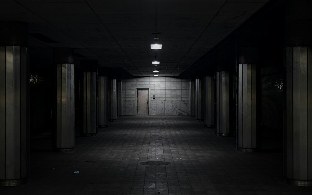 detective in dark corridor